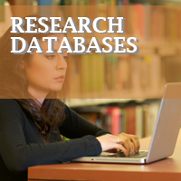 Woman looking at laptop in library